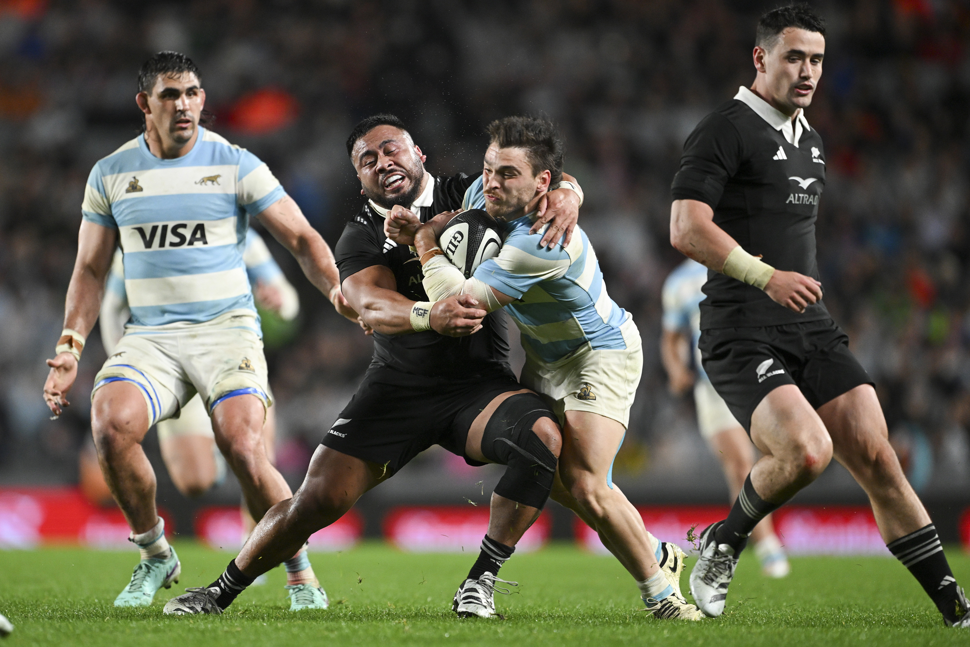 New Zealand’s Asafo Aumua tackles Argentina’s Mateo Carreras during a 2024 Rugby Championship match.