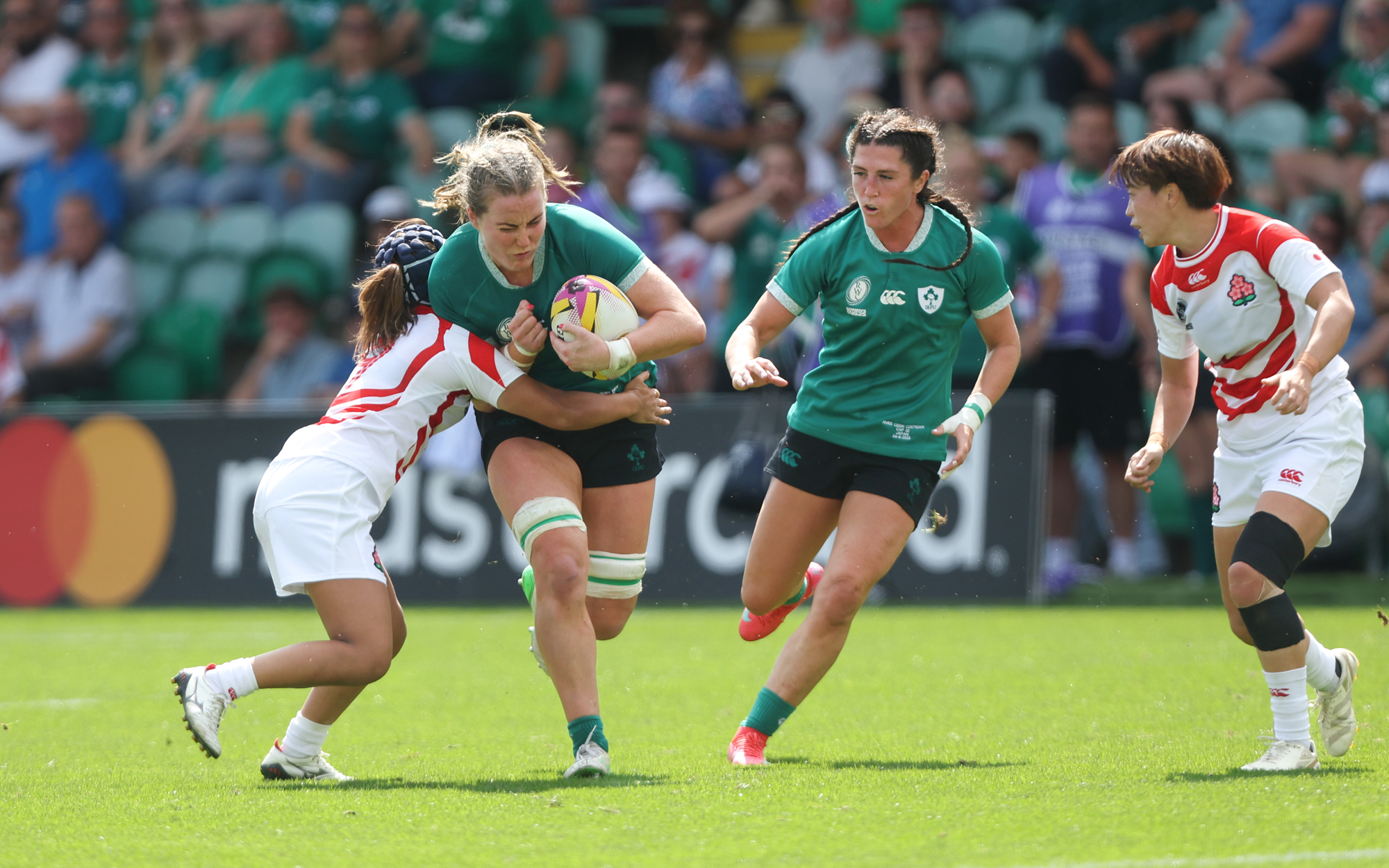 Ireland’s Fiona Tuite runs with the ball during her team