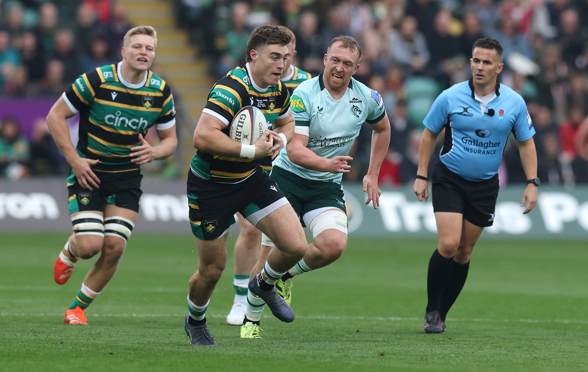 Tommy Freeman of Northampton Saints runs with the ball during the October 2025 match against Leicester Tigers